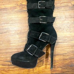 Black leather upper boots.